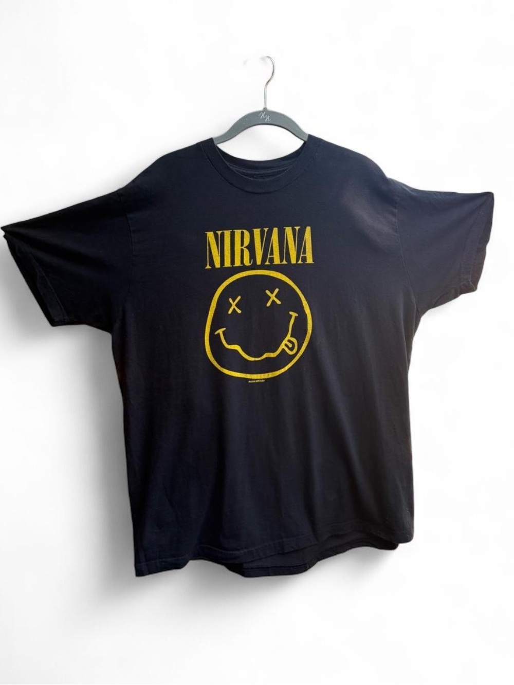 Nirvana black t-shirt with yellow smiley face graphic